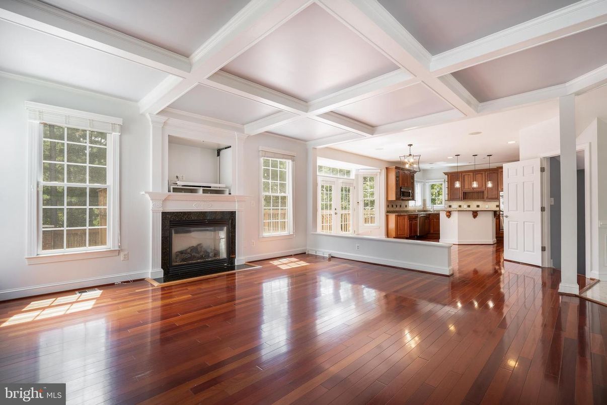 Empty room, Fireplace, Interior, Kitchen, Pendant Lights, Recessed Lighting, Wood Texture Flooring