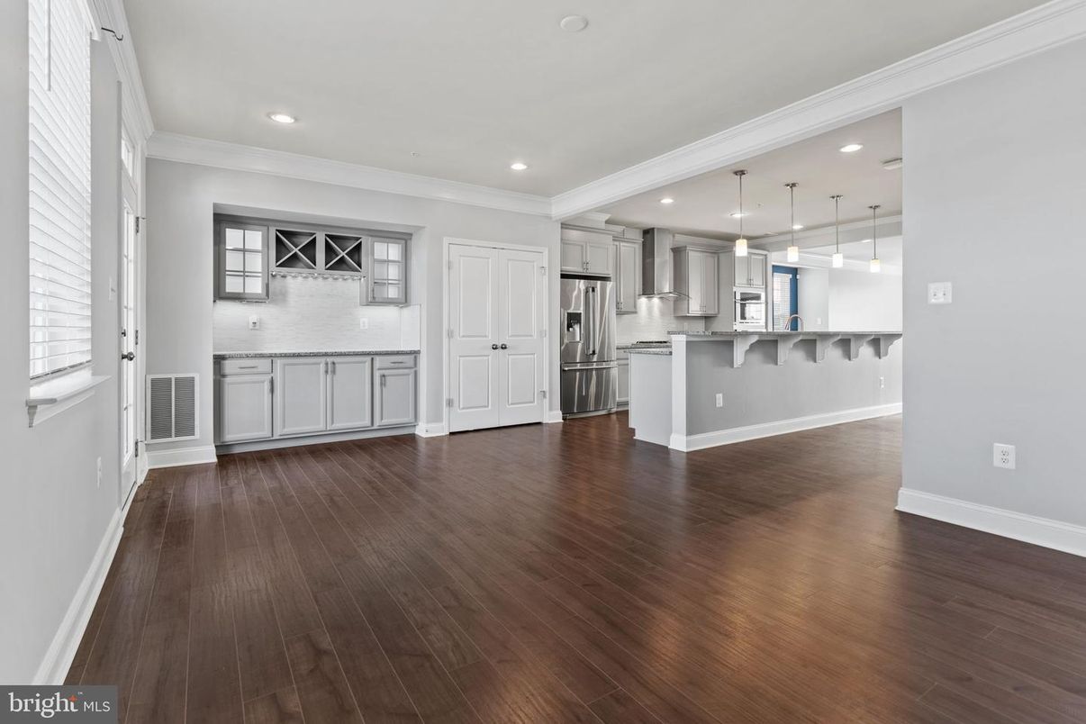 Empty room, Interior, Kitchen, Pendant Lights, Recessed Lighting, Stainless Steel Appliances, Wood Texture Flooring