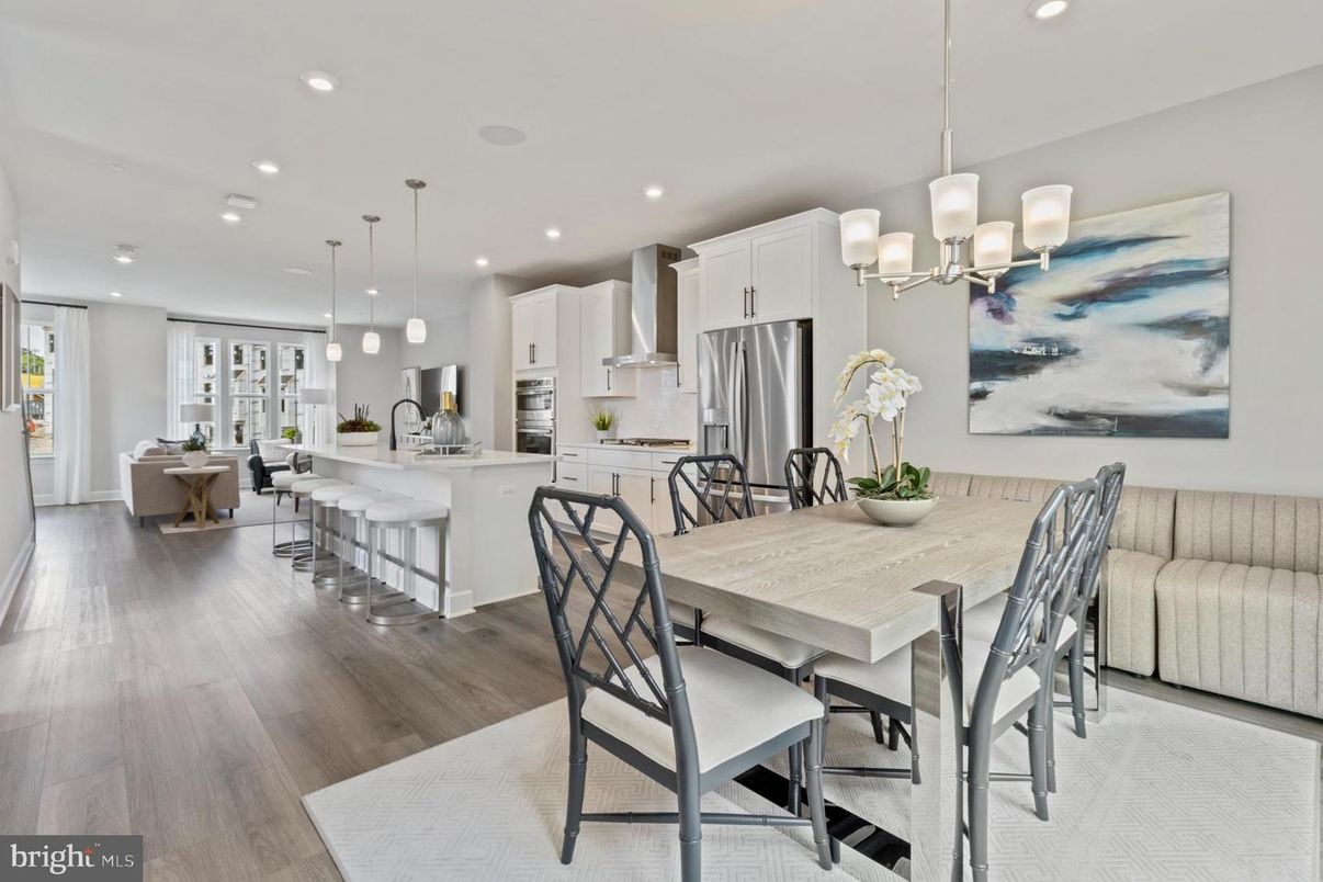 Chandelier, Dining room, Interior, Kitchen, Living room, Pendant Lights, Recessed Lighting, Stainless Steel Appliances, Wood Texture Flooring