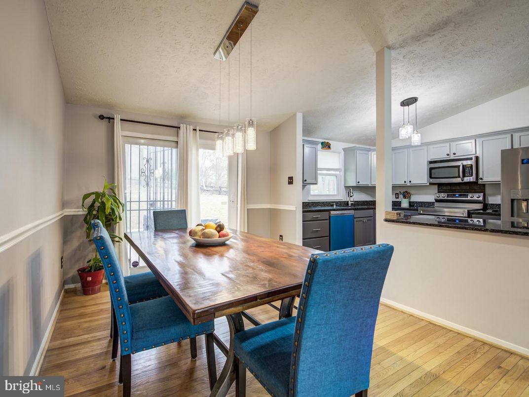 Dining room, Interior, Kitchen, Pendant Lights, Stainless Steel Appliances, Wood Texture Flooring