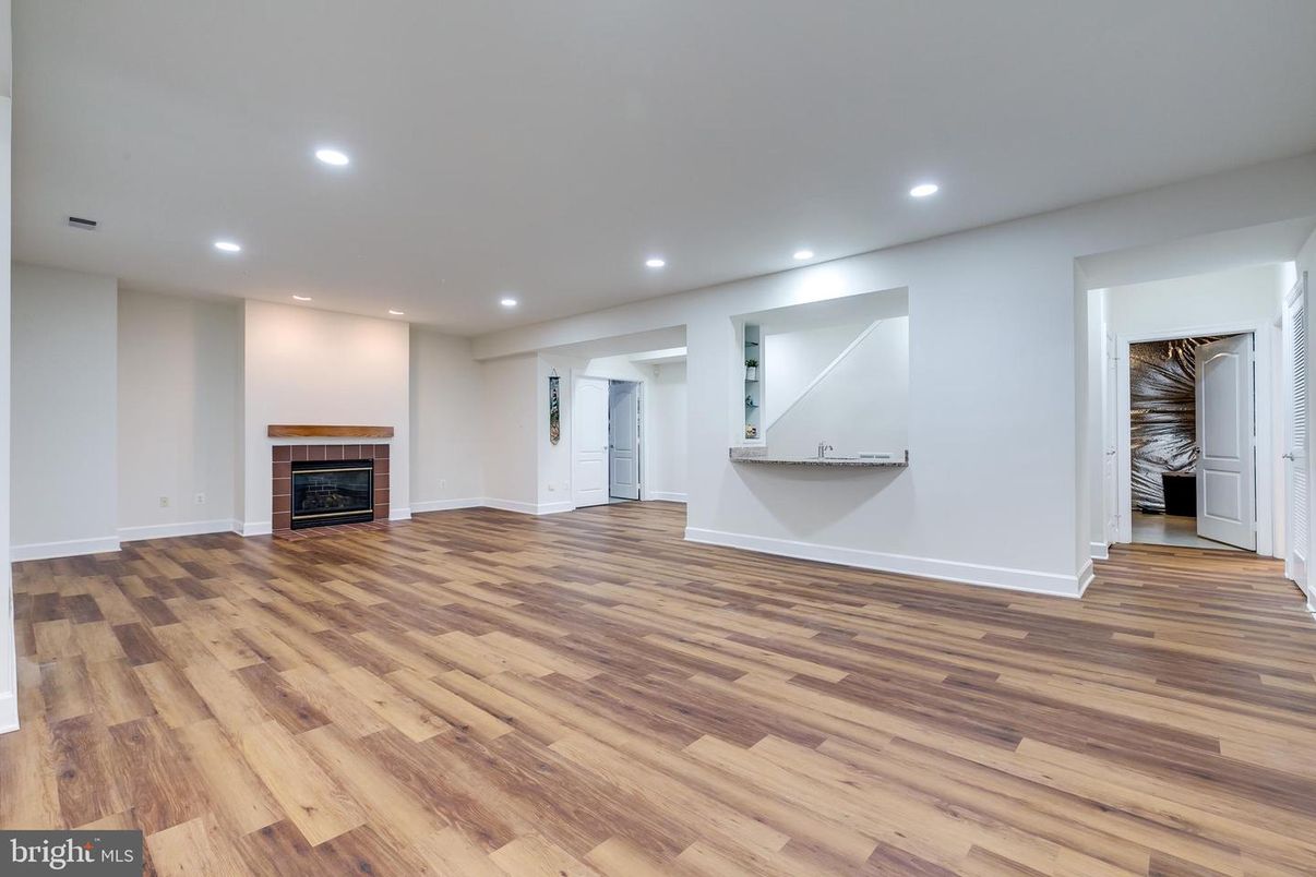 Empty room, Fireplace, Interior, Recessed Lighting, Wood Texture Flooring