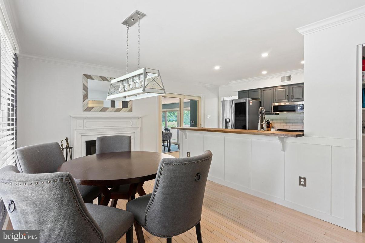 Dining room, Fireplace, Interior, Kitchen, Pendant Lights, Recessed Lighting, Stainless Steel Appliances, Wood Texture Flooring