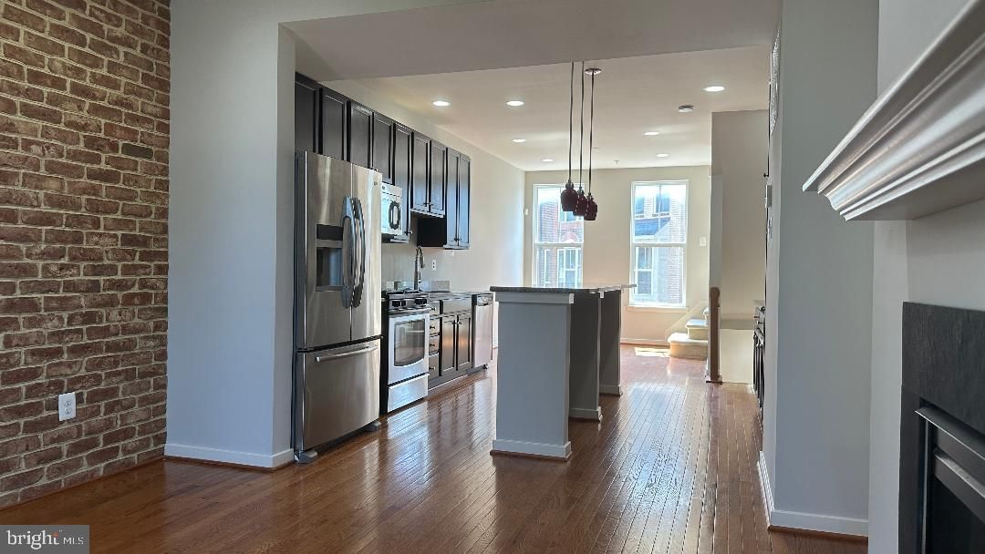 Interior, Kitchen, Pendant Lights, Recessed Lighting, Stainless Steel Appliances, Stone Walls, Wood Texture Flooring