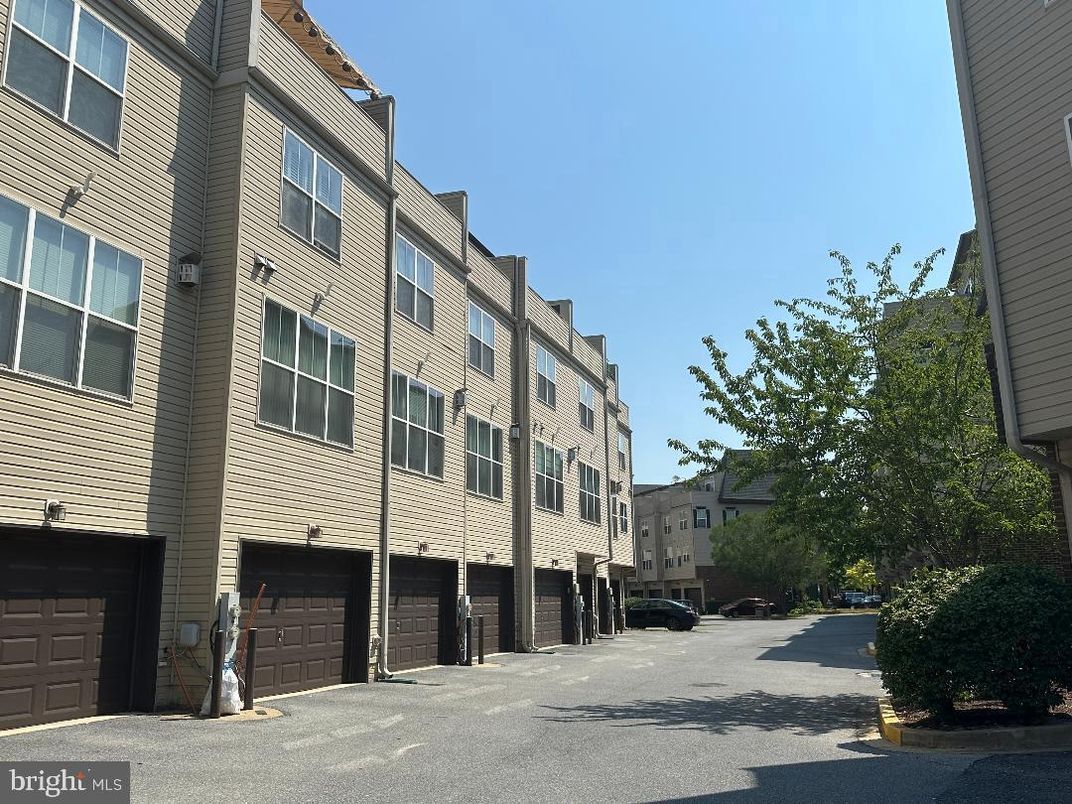 Attached, Exterior, Facade, Brick Facade, Condo Building