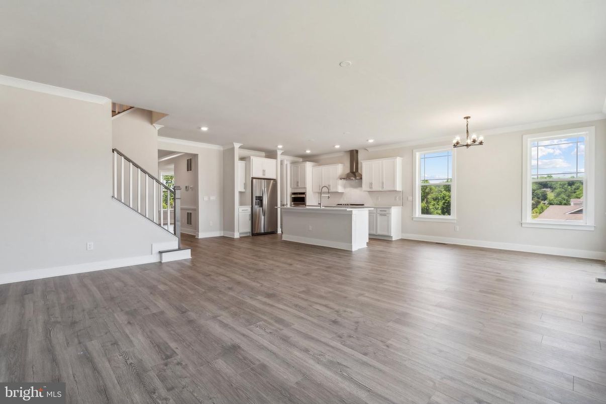 Chandelier, Empty room, Interior, Kitchen, Recessed Lighting, Stainless Steel Appliances, Wood Texture Flooring