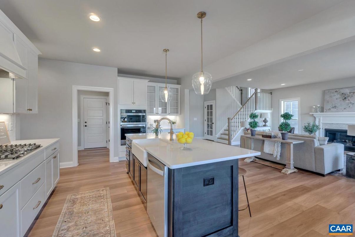 Fireplace, Interior, Kitchen, Living room, Pendant Lights, Recessed Lighting, Stainless Steel Appliances, Wood Texture Flooring