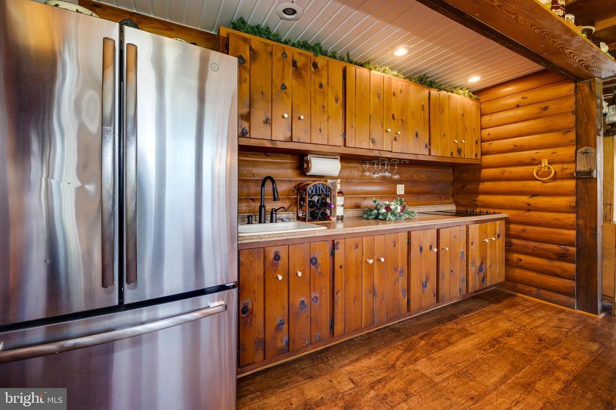 Interior, Kitchen, Recessed Lighting, Stainless Steel Appliances, Wood Texture Flooring, Wooden Walls