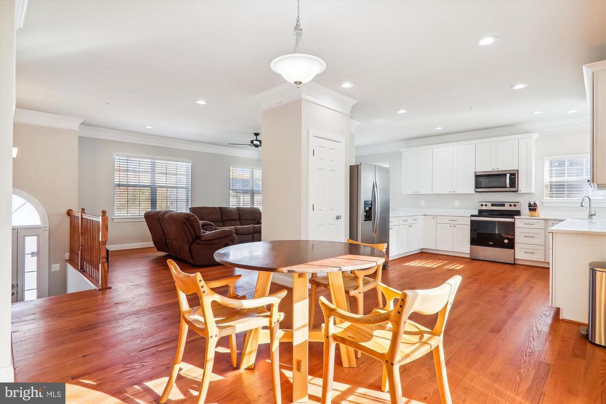 Dining room, Interior, Kitchen, Pendant Lights, Recessed Lighting, Stainless Steel Appliances, Wood Texture Flooring
