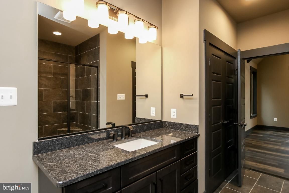 Bathroom, Dual Sink Vanities, Interior, Recessed Lighting, Wood Texture Flooring