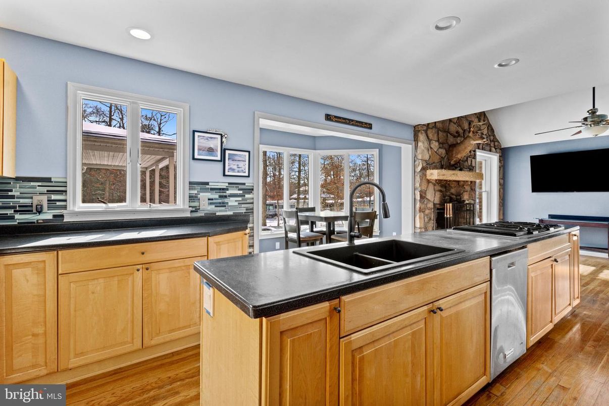Dining room, Fireplace, Interior, Kitchen, Recessed Lighting, Wood Texture Flooring
