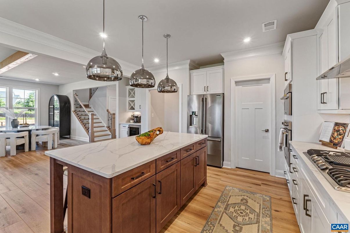 Dining room, Interior, Kitchen, Pendant Lights, Recessed Lighting, Stainless Steel Appliances, Wood Texture Flooring