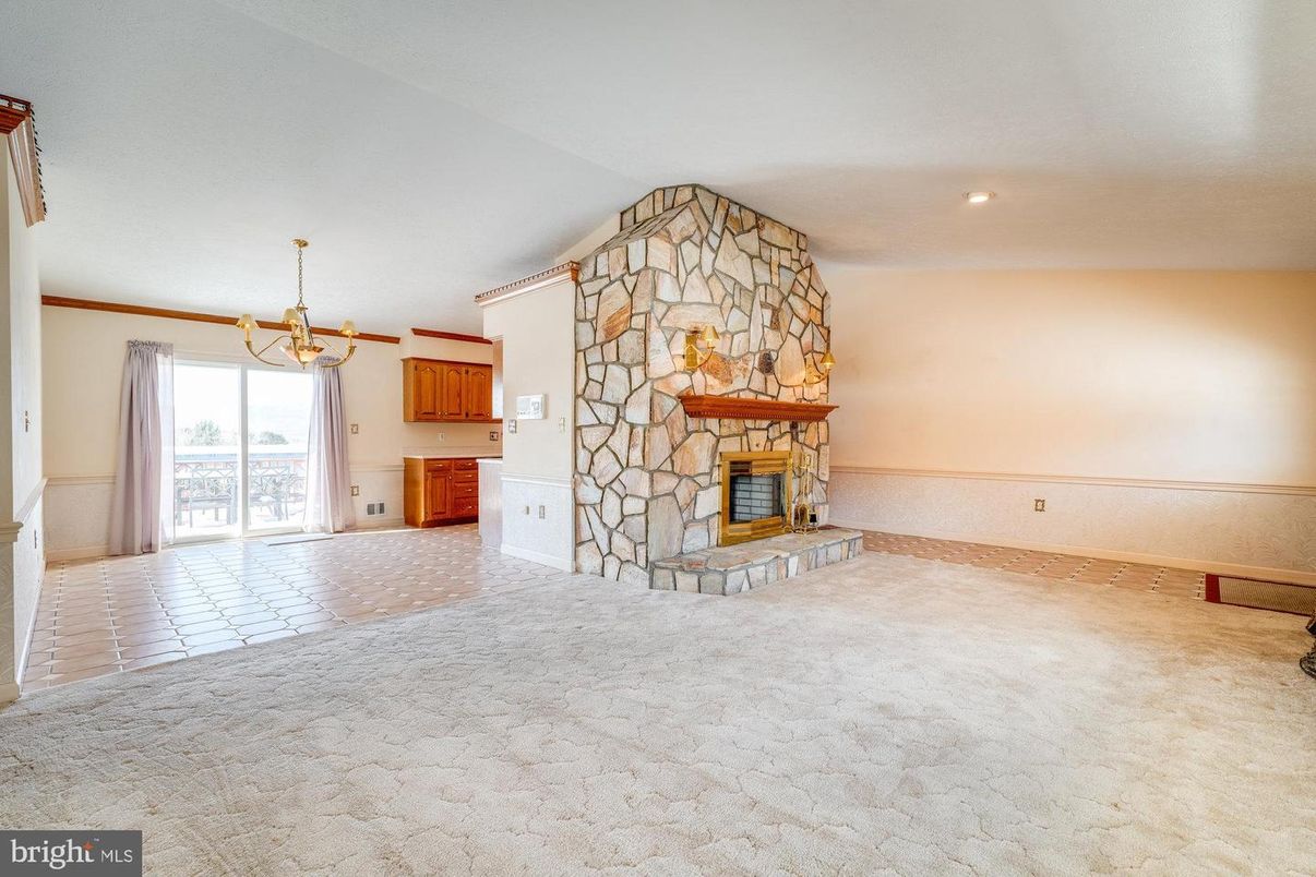 Chandelier, Empty room, Fireplace, Interior, Recessed Lighting, Stone Walls