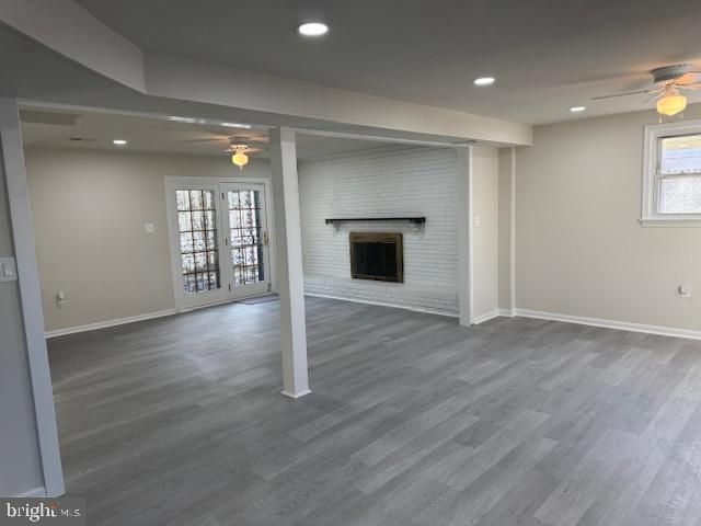 Empty room, Fireplace, Interior, Recessed Lighting, Stone Walls, Wood Texture Flooring