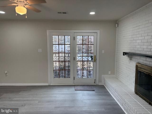 Empty room, Fireplace, Interior, Recessed Lighting, Stone Walls, Wood Texture Flooring