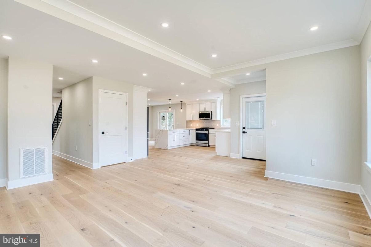 Empty room, Interior, Kitchen, Pendant Lights, Recessed Lighting, Stainless Steel Appliances, Wood Texture Flooring