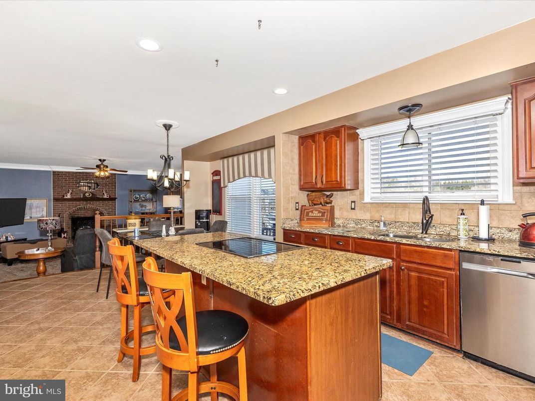 Dining room, Fireplace, Interior, Kitchen, Pendant Lights, Recessed Lighting, Stainless Steel Appliances, Stone Walls