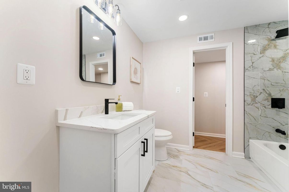 Bathroom, Dual Sink Vanities, Interior, Marble, Marble Walls, Recessed Lighting