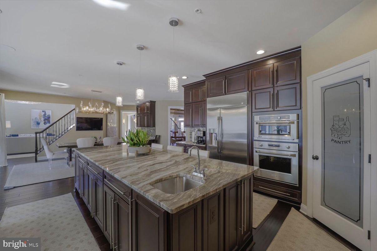 Dining room, Interior, Kitchen, Pendant Lights, Recessed Lighting, Stainless Steel Appliances, Wood Texture Flooring