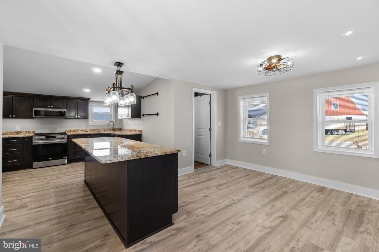 Chandelier, Interior, Kitchen, Pendant Lights, Recessed Lighting, Stainless Steel Appliances, Wood Texture Flooring
