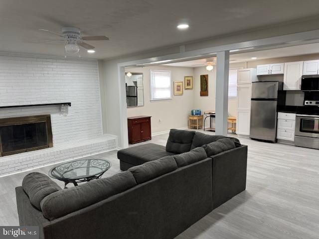 Fireplace, Interior, Kitchen, Living room, Recessed Lighting, Stainless Steel Appliances, Stone Walls, Wood Texture Flooring