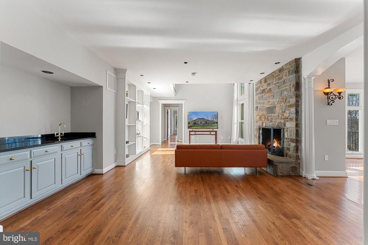 Fireplace, Interior, Living room, Recessed Lighting, Stone Walls, Wood Texture Flooring