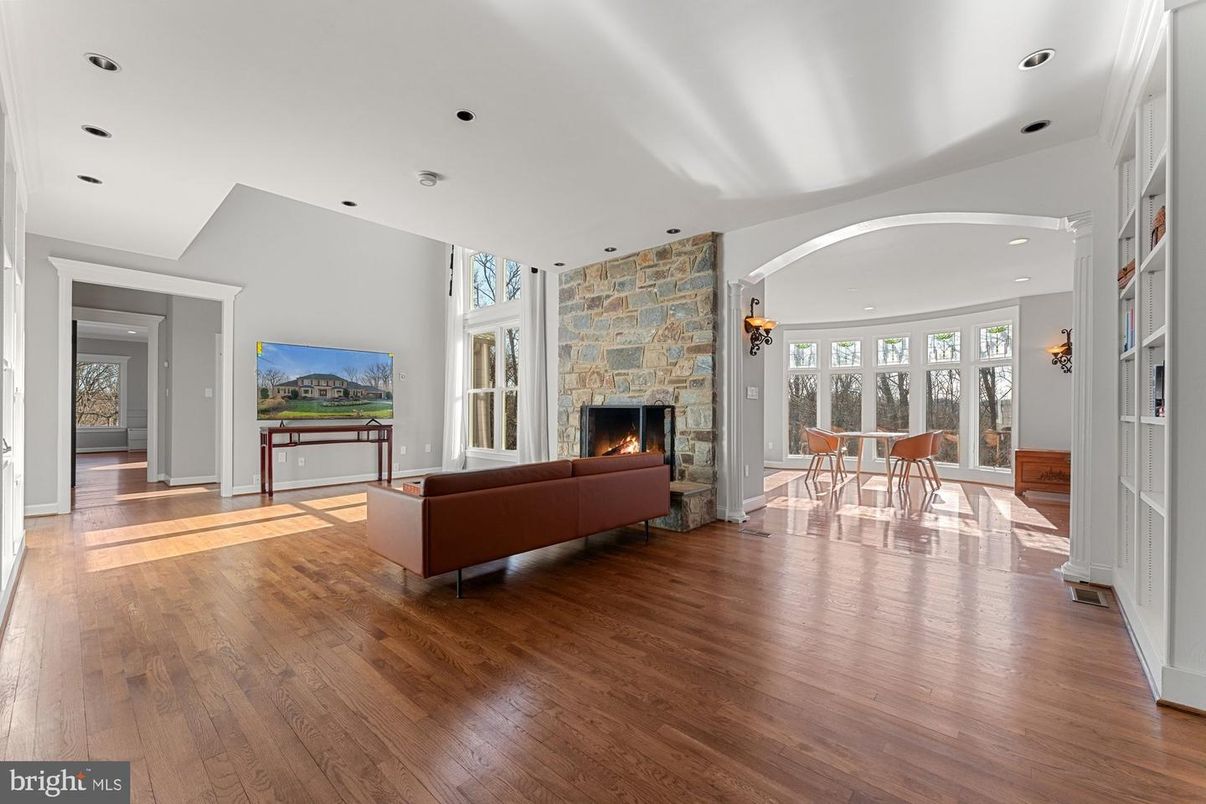 Dining room, Fireplace, Interior, Living room, Recessed Lighting, Wood Texture Flooring