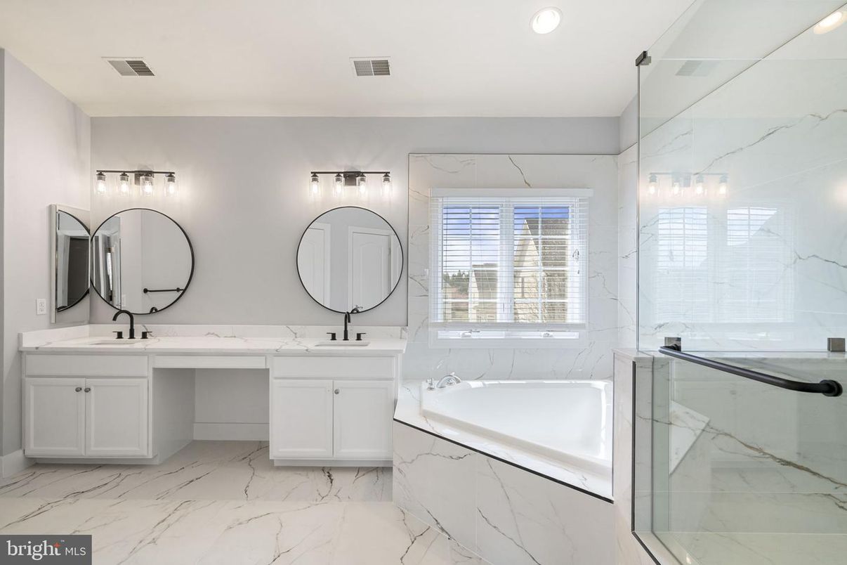 Bathroom, Dual Sink Vanities, Glass Shower, Interior, Marble, Marble Walls, Recessed Lighting