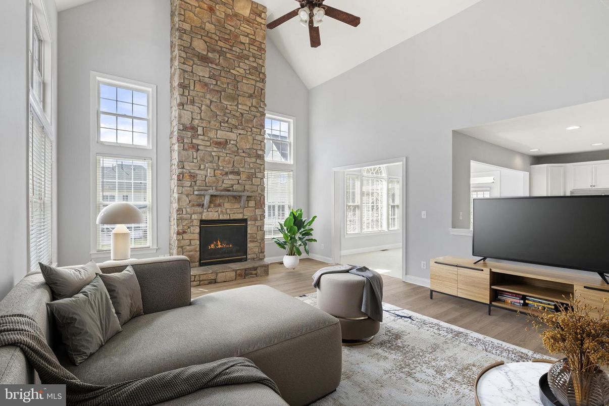 Fireplace, Interior, Living room, Recessed Lighting, Stone Walls, Wood Texture Flooring