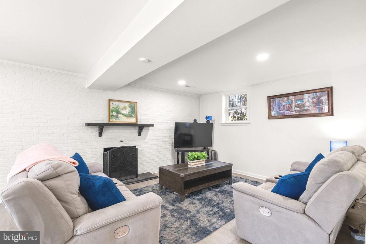 Fireplace, Interior, Living room, Recessed Lighting, Stone Walls, Wood Texture Flooring