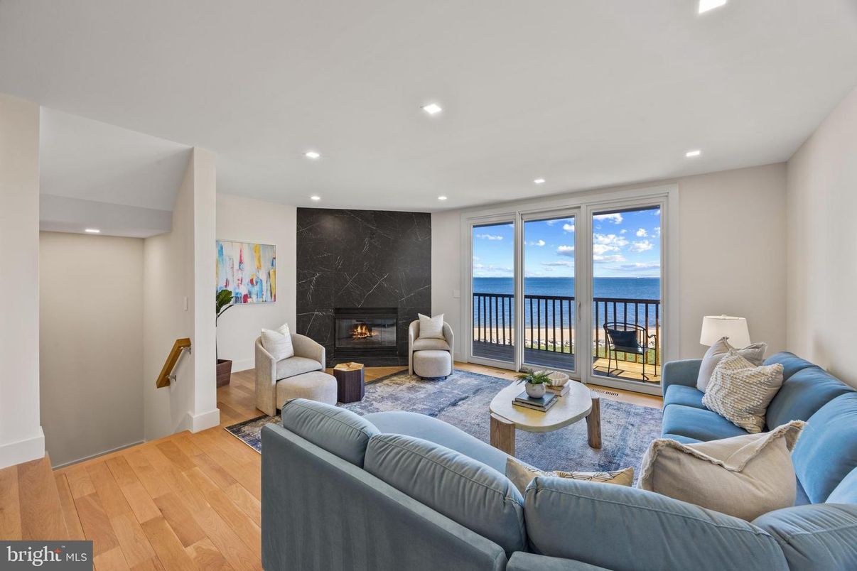 Fireplace, Interior, Living room, Marble Walls, Recessed Lighting, Water, Wood Texture Flooring