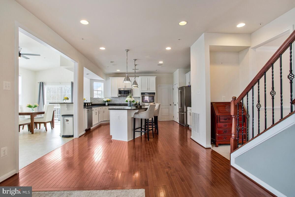 Dining room, Interior, Kitchen, Pendant Lights, Recessed Lighting, Stainless Steel Appliances, Wood Texture Flooring
