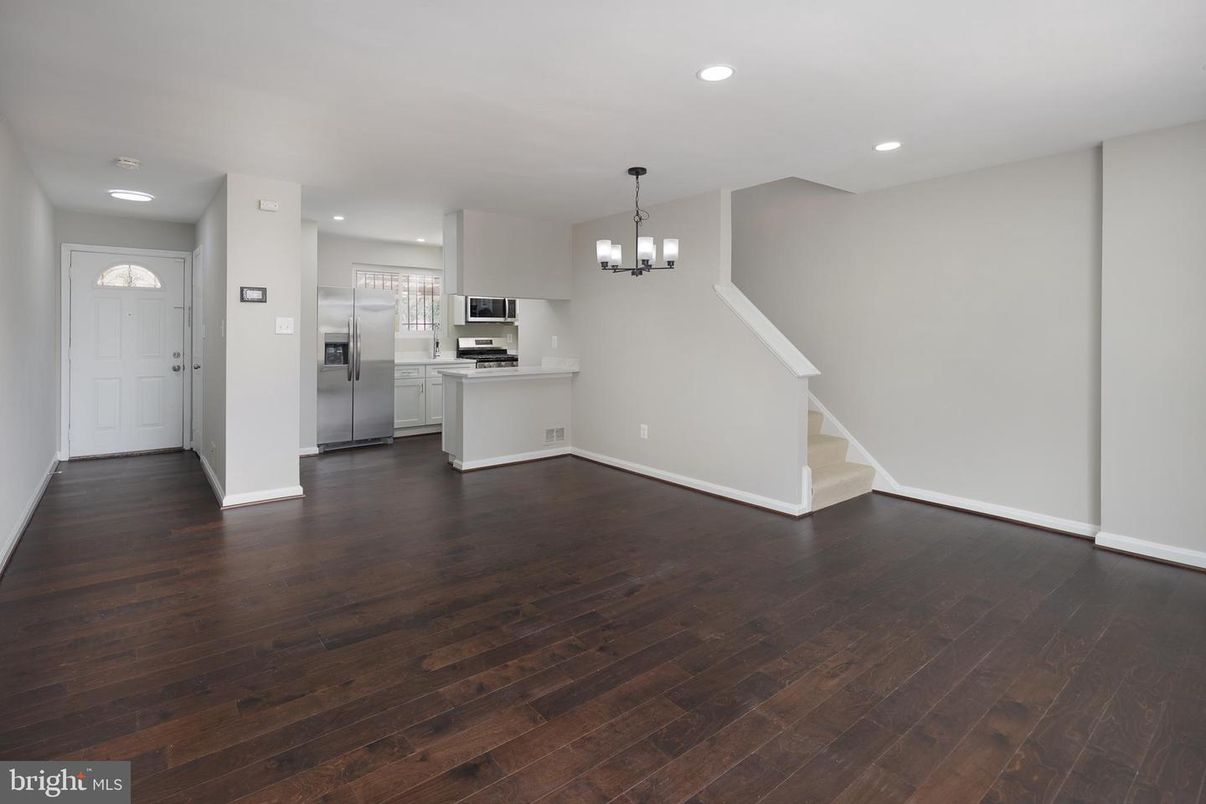 Chandelier, Empty room, Interior, Kitchen, Recessed Lighting, Stainless Steel Appliances, Wood Texture Flooring