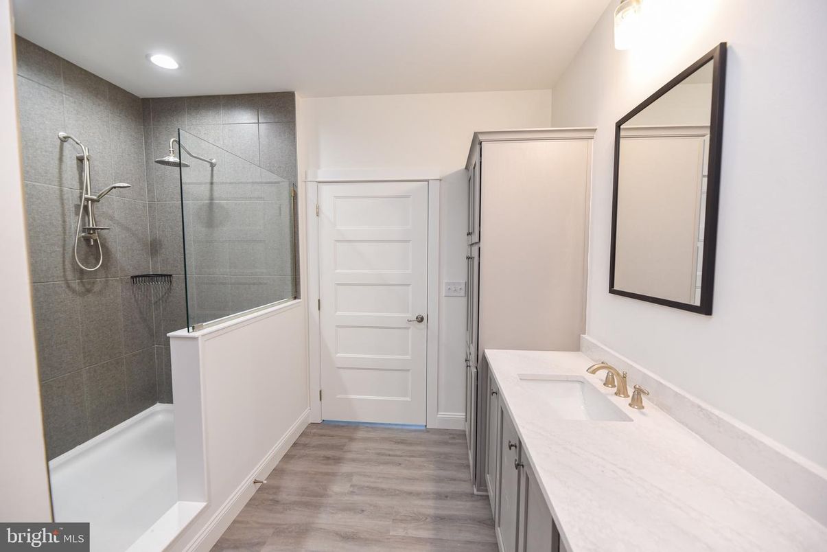 Bathroom, Dual Sink Vanities, Glass Shower, Interior, Recessed Lighting, Wood Texture Flooring