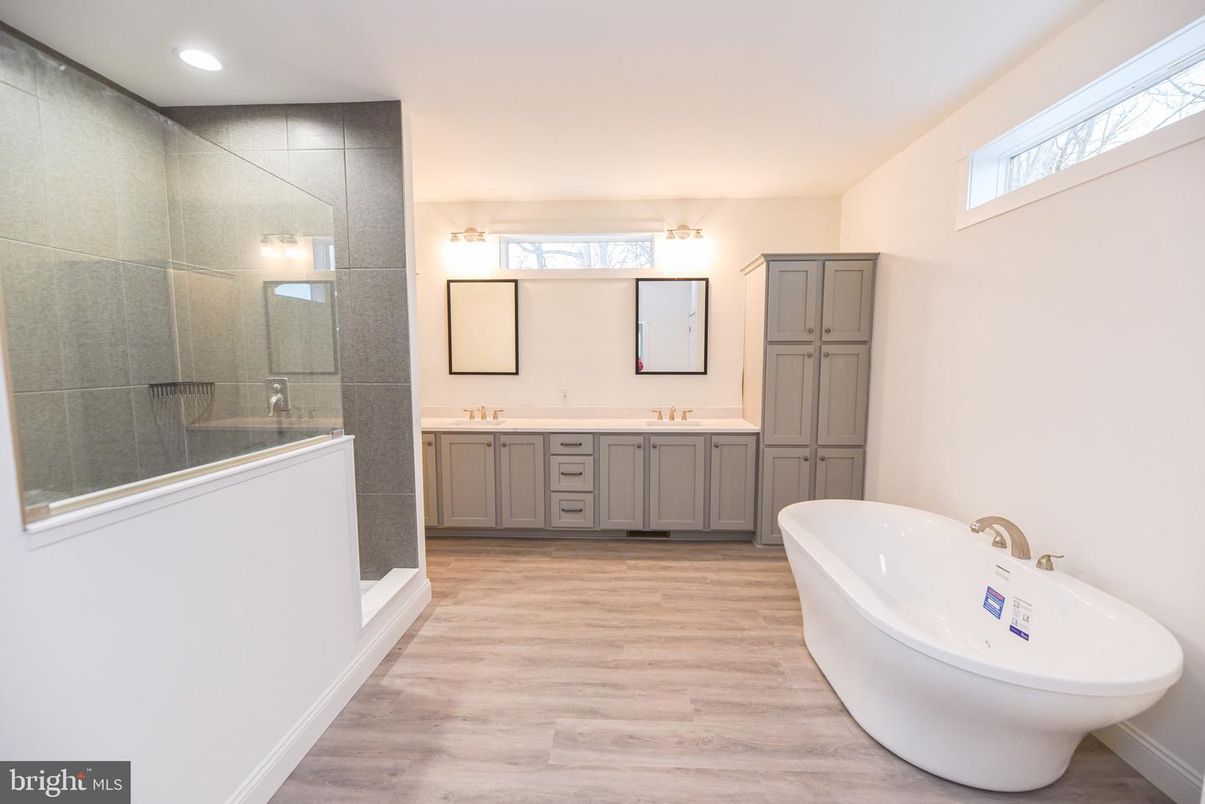 Bathroom, Dual Sink Vanities, Glass Shower, Interior, Recessed Lighting, Wood Texture Flooring