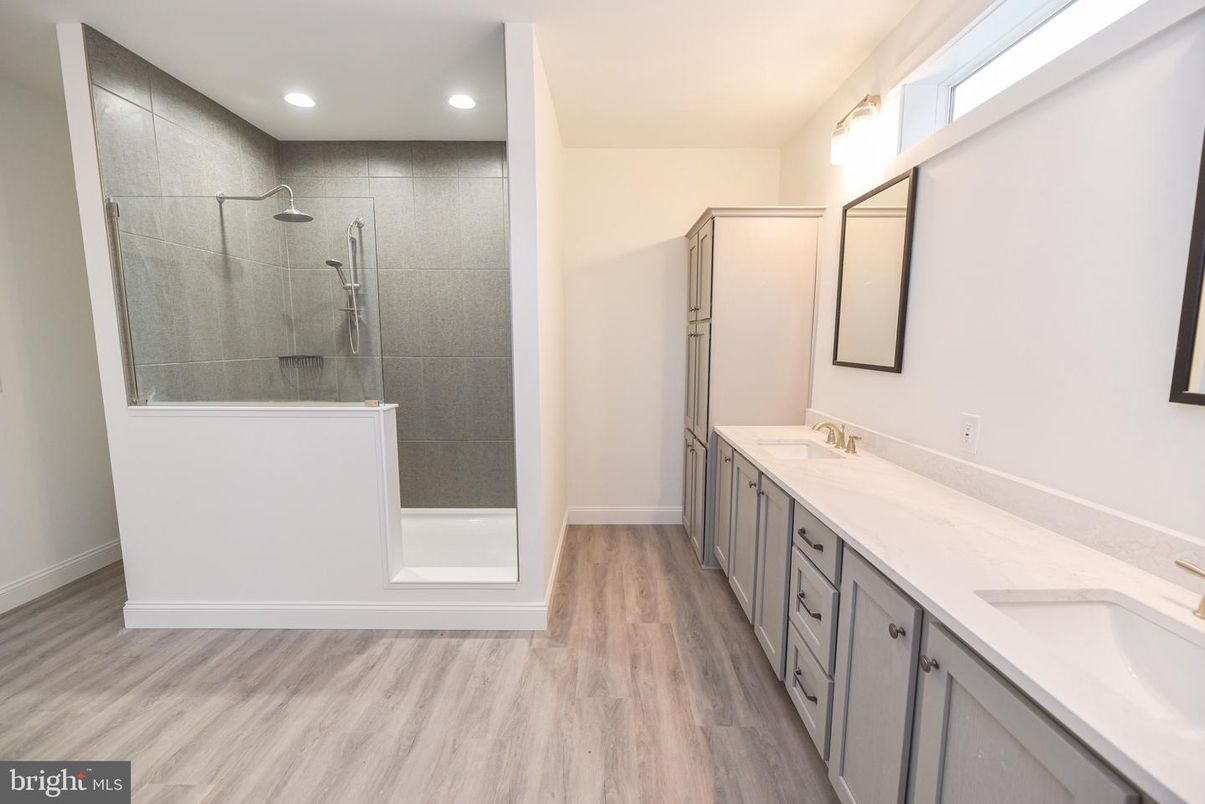 Bathroom, Dual Sink Vanities, Glass Shower, Interior, Recessed Lighting, Wood Texture Flooring