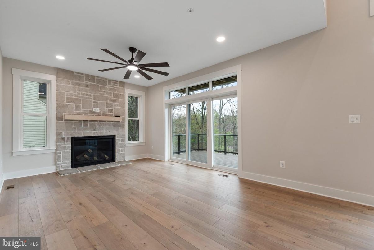 Empty room, Fireplace, Interior, Recessed Lighting, Stone Walls, Wood Texture Flooring