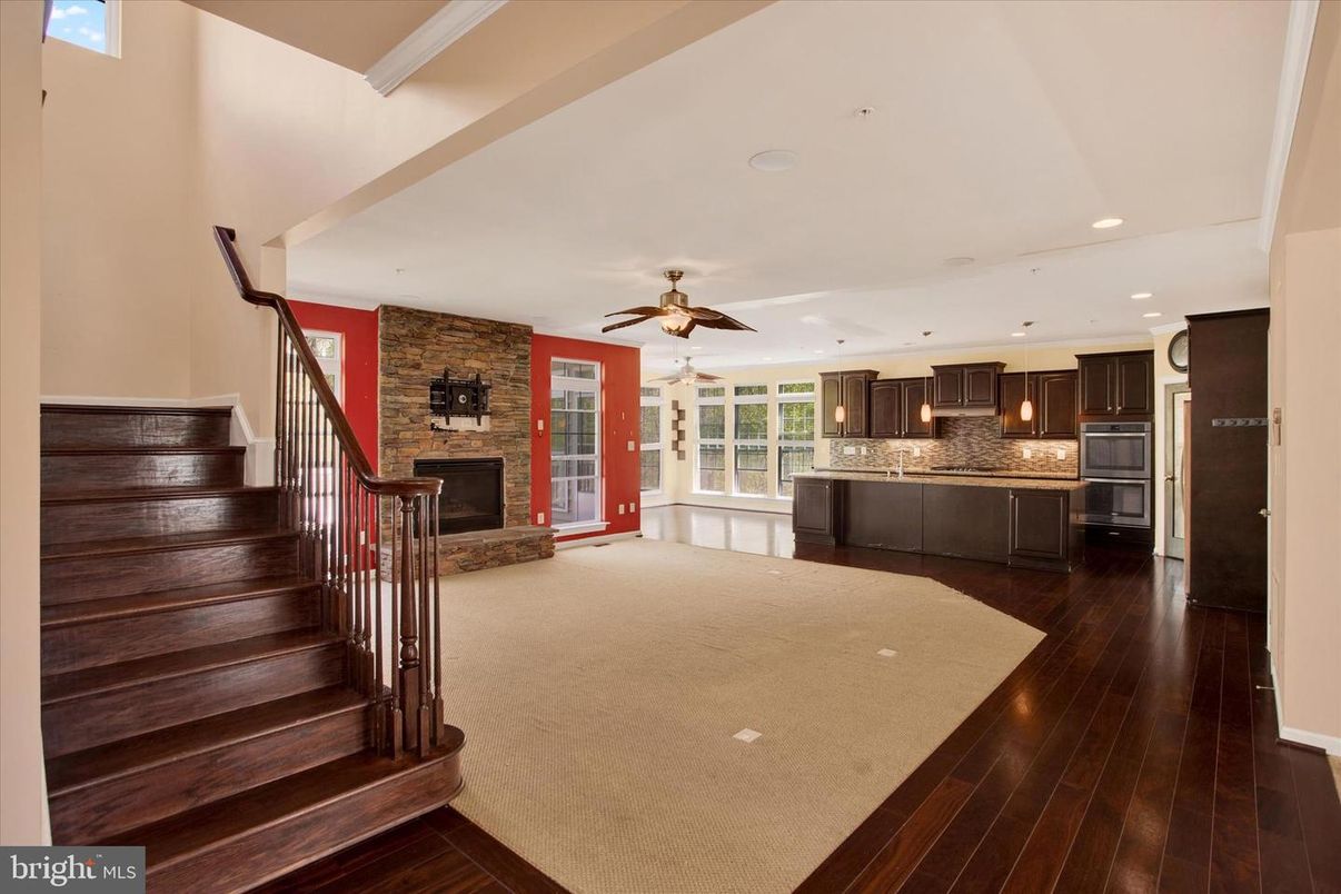 Fireplace, Interior, Kitchen, Recessed Lighting, Stainless Steel Appliances, Stone Walls, Wood Texture Flooring