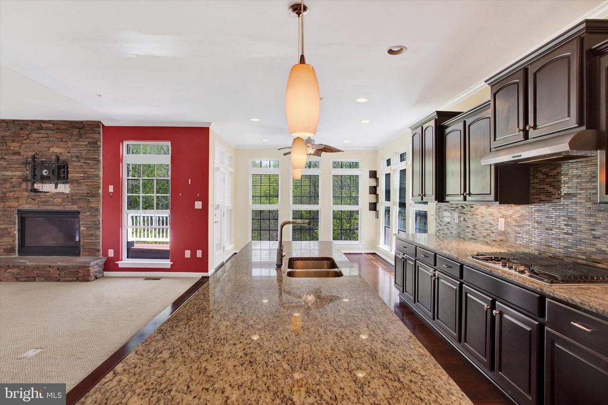 Fireplace, Interior, Kitchen, Pendant Lights, Recessed Lighting, Stone Walls, Wood Texture Flooring
