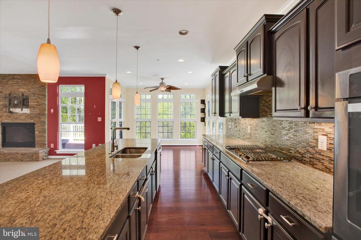 Fireplace, Interior, Kitchen, Pendant Lights, Recessed Lighting, Stone Walls, Wood Texture Flooring