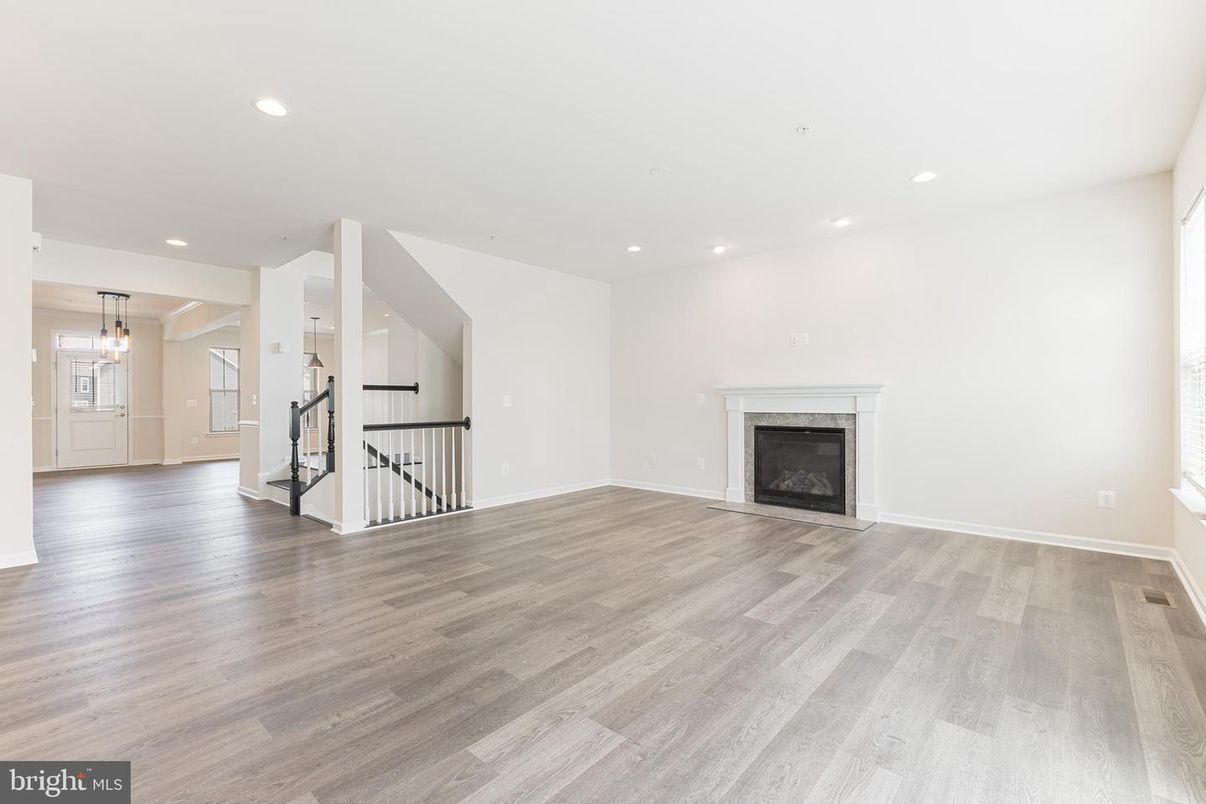 Empty room, Fireplace, Interior, Pendant Lights, Recessed Lighting, Wood Texture Flooring