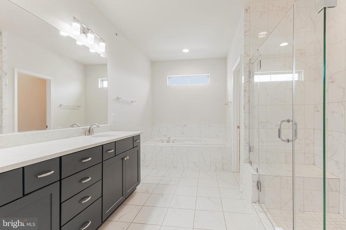 Bathroom, Dual Sink Vanities, Glass Shower, Interior, Marble, Marble Walls, Recessed Lighting