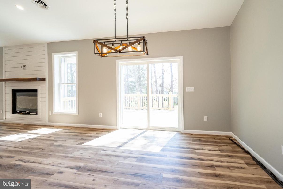 Empty room, Fireplace, Interior, Pendant Lights, Recessed Lighting, Wood Texture Flooring