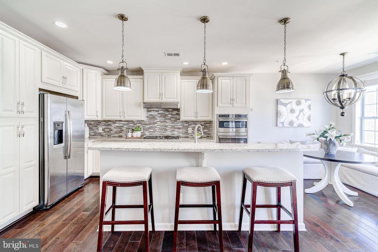 Dining room, Interior, Kitchen, Pendant Lights, Recessed Lighting, Stainless Steel Appliances, Wood Texture Flooring