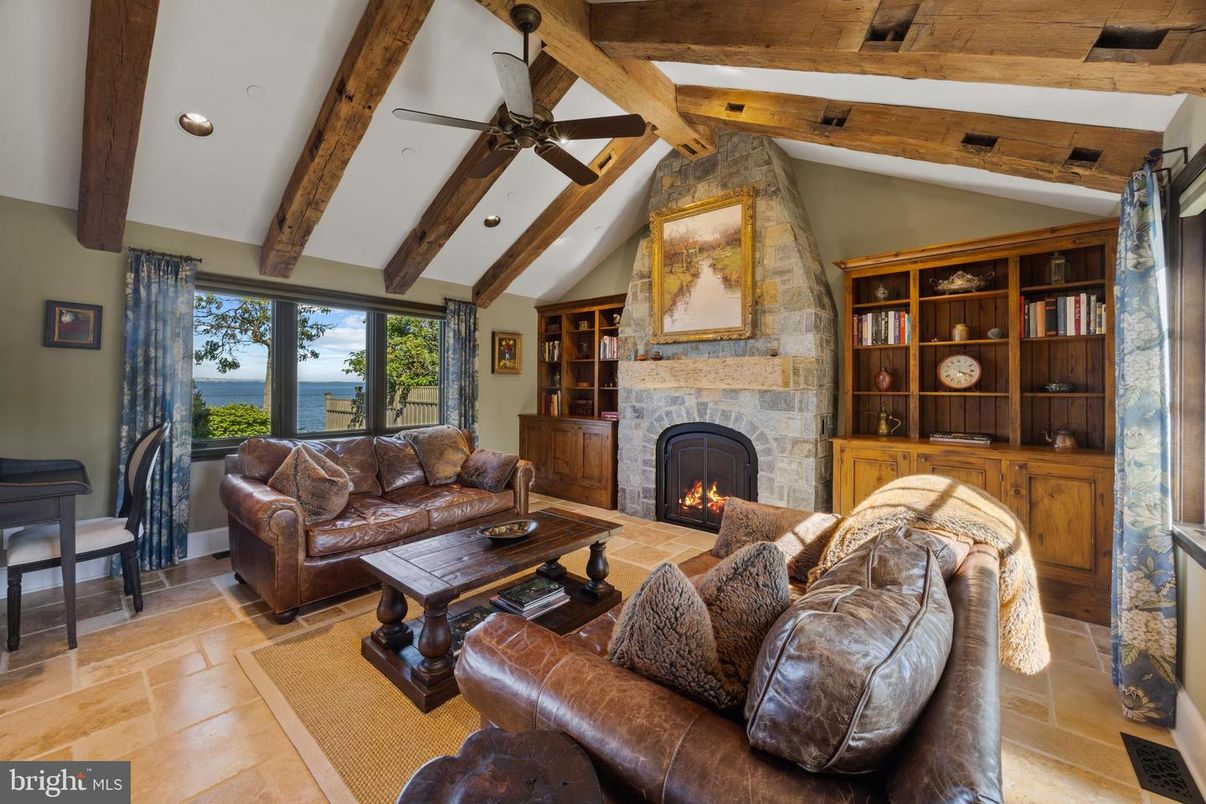 Fireplace, Interior, Living room, Recessed Lighting, Stone Walls, Water, Wooden Beams