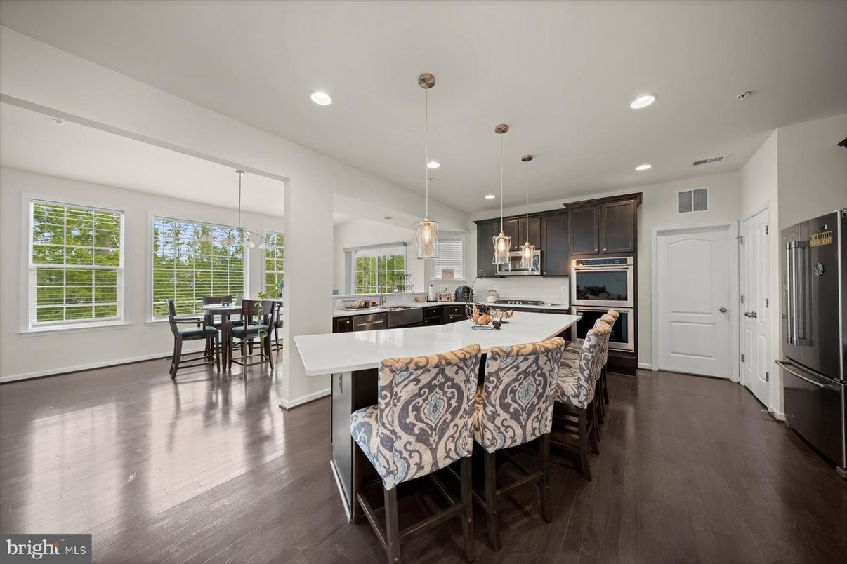 Dining room, Interior, Kitchen, Pendant Lights, Recessed Lighting, Stainless Steel Appliances, Wood Texture Flooring