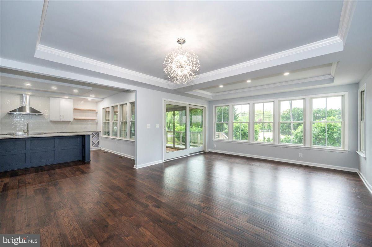 Chandelier, Empty room, Interior, Kitchen, Recessed Lighting, Stainless Steel Appliances, Wood Texture Flooring