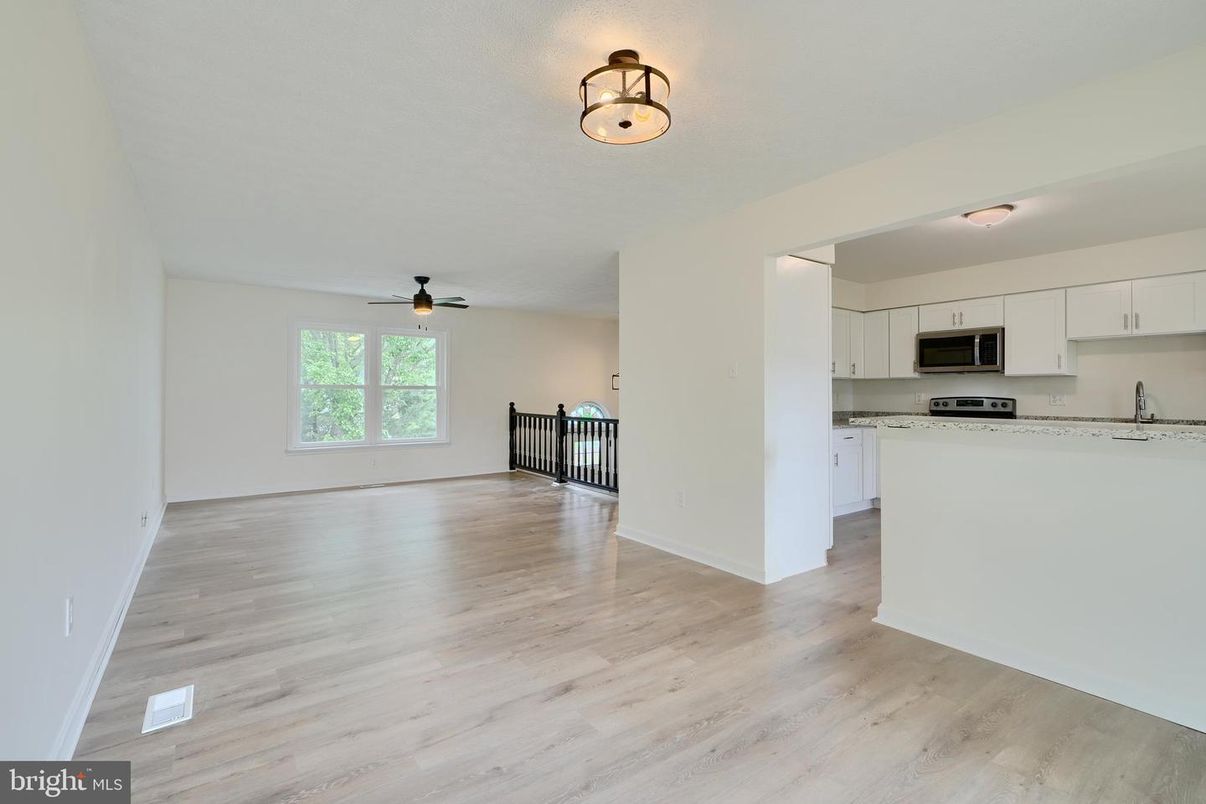Empty room, Interior, Kitchen, Stainless Steel Appliances, Wood Texture Flooring