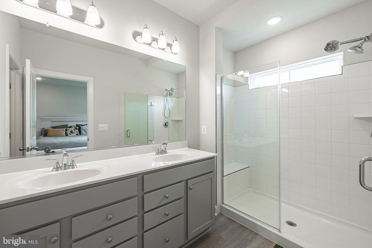 Bathroom, Dual Sink Vanities, Glass Shower, Interior, Recessed Lighting, Wood Texture Flooring