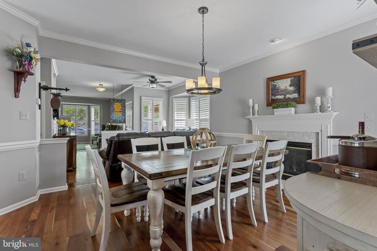 Dining room, Fireplace, Interior, Living room, Pendant Lights, Recessed Lighting, Wood Texture Flooring