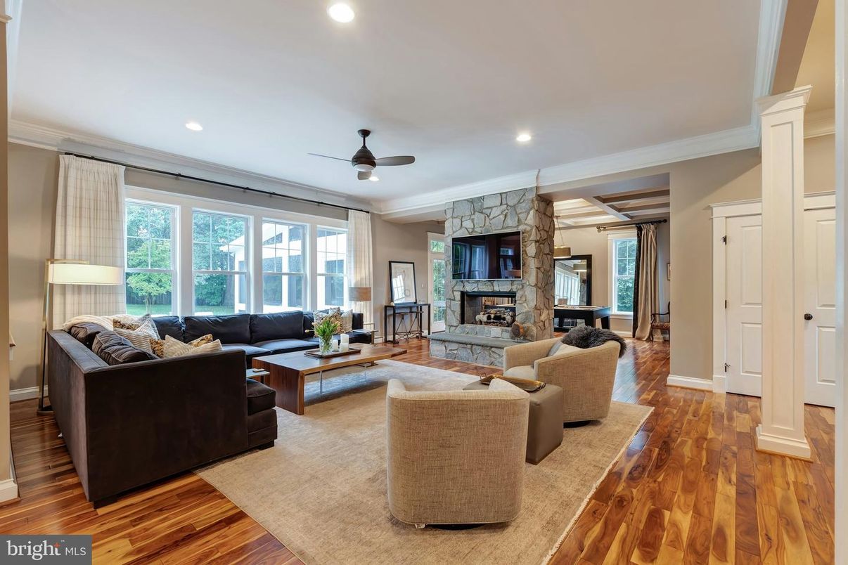 Fireplace, Interior, Living room, Recessed Lighting, Stone Walls, Wood Texture Flooring